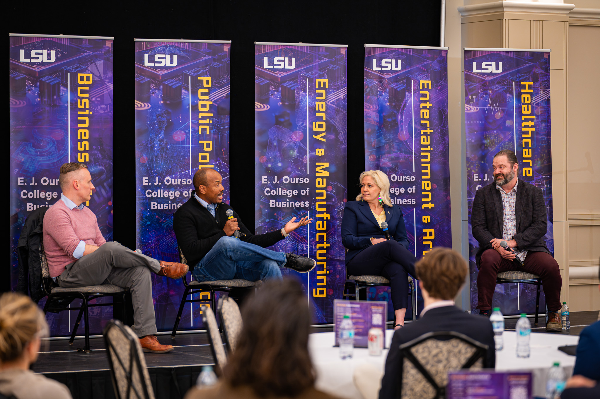 Members of the AI in Arts and Entertainment panel hold a discussion at the AI in Action Symposium on February 21, 2025.
