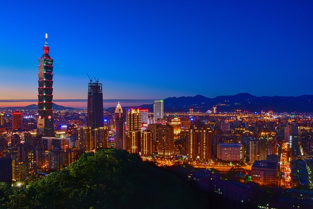 Taipei's glittering skyline against a cobalt blue sky as twilight falls on the city