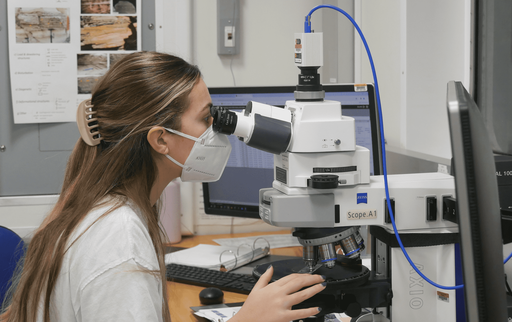 Student looking into a microscope
